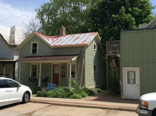 Photo of the rental property's metal roof primed where the bare metal was exposed.