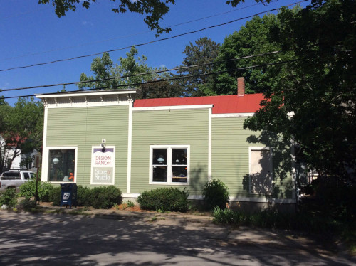 After photo shot from the street side of Design Ranch in Iowa City, showing off the fresh red roof.