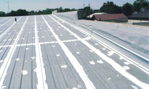 Photo of the prepped edge of a grocery store's metal roof.